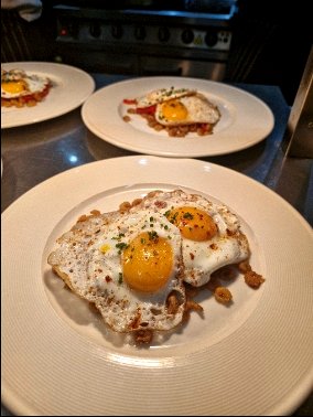 Spanish huevo rotos dish with fried eggs served during a Chesil Rectory wine dinner in Winchester