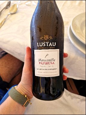 Bottle of Manzanilla Papirusa wine being served during a Chesil Rectory wine dinner tasting in Winchester