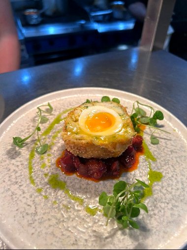 Salt cod scotch egg with chorizo jam served during a wine dinner in Winchester